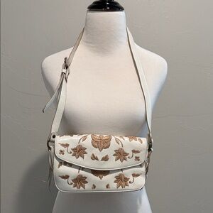 White, leather purse.